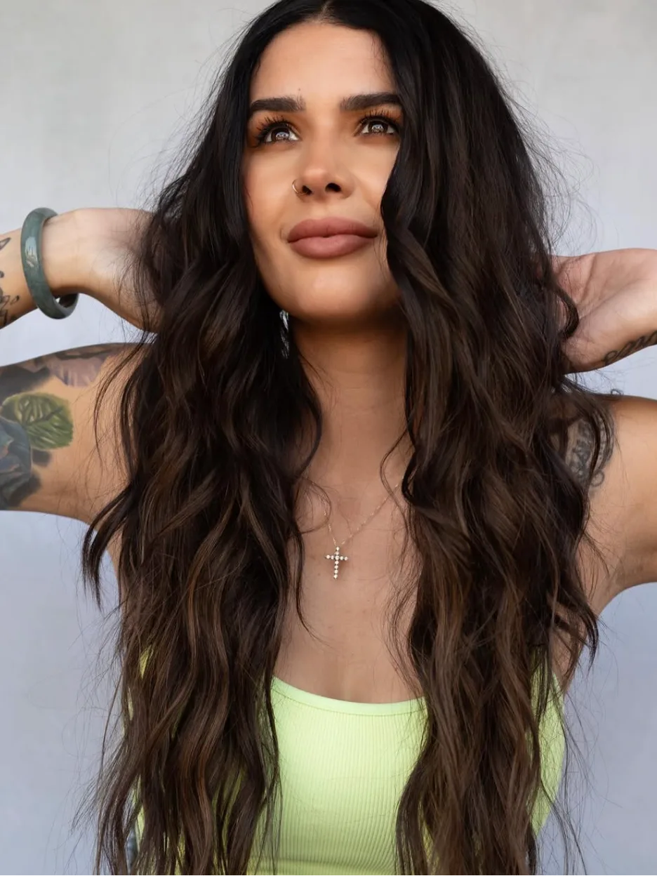 A Terri Doheny client with long, full, natural-looking brunette extensions